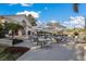 Outdoor patio dining area with umbrellas and string lights at 5023 Tobermory Way, Bradenton, FL 34211