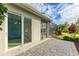 Outdoor patio with sliding glass doors, screened enclosure, and a view of the pool at 5023 Tobermory Way, Bradenton, FL 34211