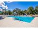 Inviting community pool with lounge chairs and umbrellas at 5023 Tobermory Way, Bradenton, FL 34211