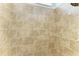 Large shower with beige tile and a rain shower head at 5023 Tobermory Way, Bradenton, FL 34211