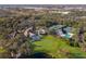 Aerial view of community amenities including clubhouse, pool, and tennis courts at 5318 88Th E St, Bradenton, FL 34211