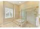 Bathroom with soaking tub, walk-in shower, and double vanity at 5318 88Th E St, Bradenton, FL 34211