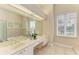 Large bathroom with double vanity and views of the backyard at 5318 88Th E St, Bradenton, FL 34211
