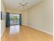 Bedroom with hardwood floors and pool view at 5318 88Th E St, Bradenton, FL 34211