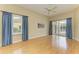 Bright bedroom with hardwood floors and sliding glass doors at 5318 88Th E St, Bradenton, FL 34211