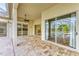 Covered patio with sliding doors to the pool and kitchen areas at 5318 88Th E St, Bradenton, FL 34211