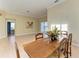 Dining area with wooden table and access to backyard at 5318 88Th E St, Bradenton, FL 34211
