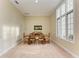 Bright dining room with large windows and a wooden dining table at 5318 88Th E St, Bradenton, FL 34211