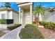 Elegant entryway with columns, double doors, and landscaping at 5318 88Th E St, Bradenton, FL 34211