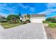 House with paver driveway and neatly landscaped yard at 5318 88Th E St, Bradenton, FL 34211