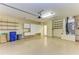Garage with built-in cabinets and shelving at 5318 88Th E St, Bradenton, FL 34211