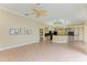Open Gathering room with a fireplace, tile floors, and sliding glass doors at 5318 88Th E St, Bradenton, FL 34211
