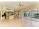 Gathering room with pool view, fireplace, and tiled floors at 5318 88Th E St, Bradenton, FL 34211
