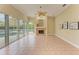 Spacious Gathering room featuring a fireplace, tile flooring, and pool views at 5318 88Th E St, Bradenton, FL 34211
