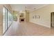 Gathering room with fireplace, tile floors, and access to the backyard at 5318 88Th E St, Bradenton, FL 34211
