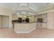 Large kitchen with island, granite countertops, and light wood cabinets at 5318 88Th E St, Bradenton, FL 34211