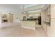 Kitchen with island, granite counters, and ample cabinetry at 5318 88Th E St, Bradenton, FL 34211
