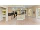 Spacious kitchen featuring an island, granite countertops, and ample cabinetry at 5318 88Th E St, Bradenton, FL 34211
