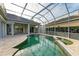 Enclosed pool and spa with covered patio and lanai at 5318 88Th E St, Bradenton, FL 34211
