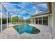 Resort style screened pool and spa with brick pavers at 5318 88Th E St, Bradenton, FL 34211