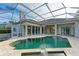 Luxury screened pool and spa with a covered patio at 5318 88Th E St, Bradenton, FL 34211