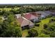 Aerial view of homes with lush landscaping and pool at 5351 Laurel Oak Ct, North Port, FL 34287