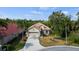 Aerial view of single-Gathering home with driveway and landscaping at 5351 Laurel Oak Ct, North Port, FL 34287