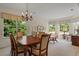 Spacious dining area with large windows and seating for six at 5351 Laurel Oak Ct, North Port, FL 34287