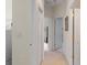 Bright hallway with access to bedrooms and laundry room at 5351 Laurel Oak Ct, North Port, FL 34287
