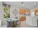 Kitchen features a breakfast nook and wood cabinets at 5351 Laurel Oak Ct, North Port, FL 34287