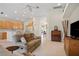 Open living room with view of kitchen and TV at 5351 Laurel Oak Ct, North Port, FL 34287