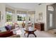 Living room with bay window and comfy seating area at 5351 Laurel Oak Ct, North Port, FL 34287