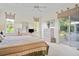 Main bedroom with sliding doors leading to a private patio at 5351 Laurel Oak Ct, North Port, FL 34287