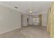 This airy bedroom features neutral walls, carpet flooring, and a sunny window at 5515 Richardson Rd, Sarasota, FL 34232