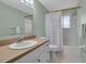 Clean bathroom with shower/tub combo and updated vanity at 5708 Miami Rd, Venice, FL 34293
