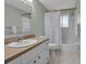 Clean bathroom with shower/tub combo and updated vanity at 5708 Miami Rd, Venice, FL 34293