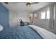 Bedroom with full bed, ceiling fan, and walk-in closet at 5708 Miami Rd, Venice, FL 34293