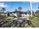 House with a screened patio and a large backyard at 5708 Miami Rd, Venice, FL 34293
