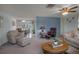 Spacious living room with ample natural light and comfortable seating at 5708 Miami Rd, Venice, FL 34293