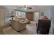 Light and airy living room with beige couches and large windows at 5708 Miami Rd, Venice, FL 34293
