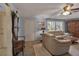 Comfortable living room featuring a tan couch and wood cabinet at 5708 Miami Rd, Venice, FL 34293