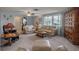 Living area showcasing neutral tones, plush seating, and a wood cabinet at 5708 Miami Rd, Venice, FL 34293
