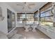 Sunroom features a dining set and sliding glass doors at 5708 Miami Rd, Venice, FL 34293