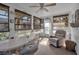 Bright sunroom with seating area and ceiling fan at 5708 Miami Rd, Venice, FL 34293