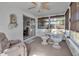 Relaxing sunroom with comfy recliner and garden views at 5708 Miami Rd, Venice, FL 34293