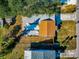 Aerial view showing home's layout, yard, and deck at 5806 15Th W St, Bradenton, FL 34207