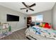 Spacious bedroom with a queen-size bed, plenty of storage, and a ceiling fan at 5806 15Th W St, Bradenton, FL 34207