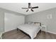 Primary bedroom with king-size bed, ceiling fan, and sliding door closet at 5806 15Th W St, Bradenton, FL 34207