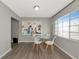 Small dining area with glass table and white chairs at 5806 15Th W St, Bradenton, FL 34207