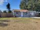 Gray house with a yard and wooden fence at 5806 15Th W St, Bradenton, FL 34207